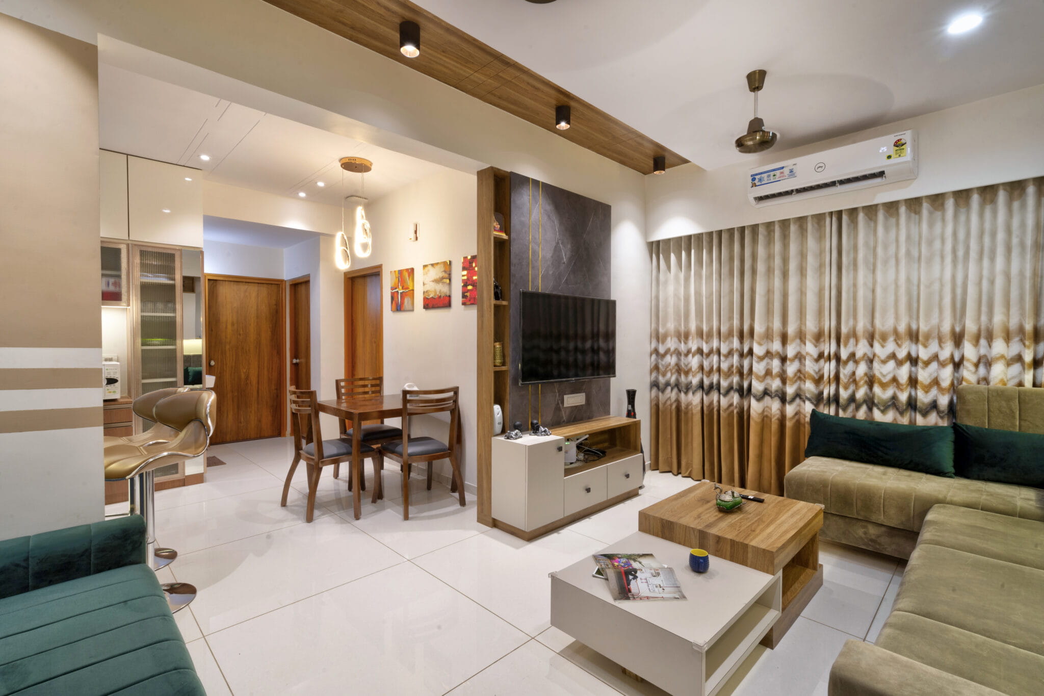 Spacious minimalist living room with wooden ceiling accents, L-shaped sofa, and marble-top center table.