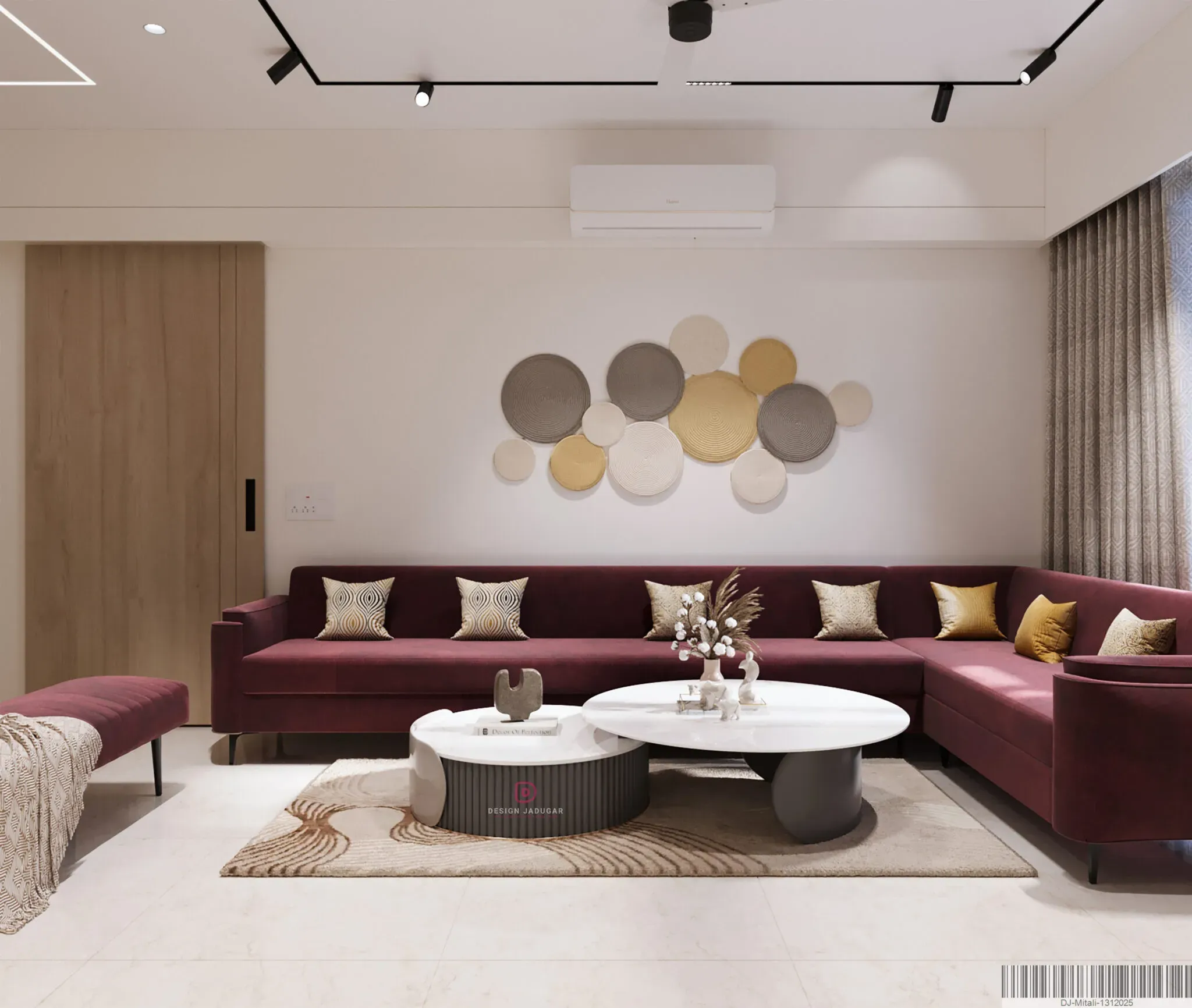 Luxury living room interior with maroon sectional sofa and designer wall decor at Rajyash Home, Ahmedabad.