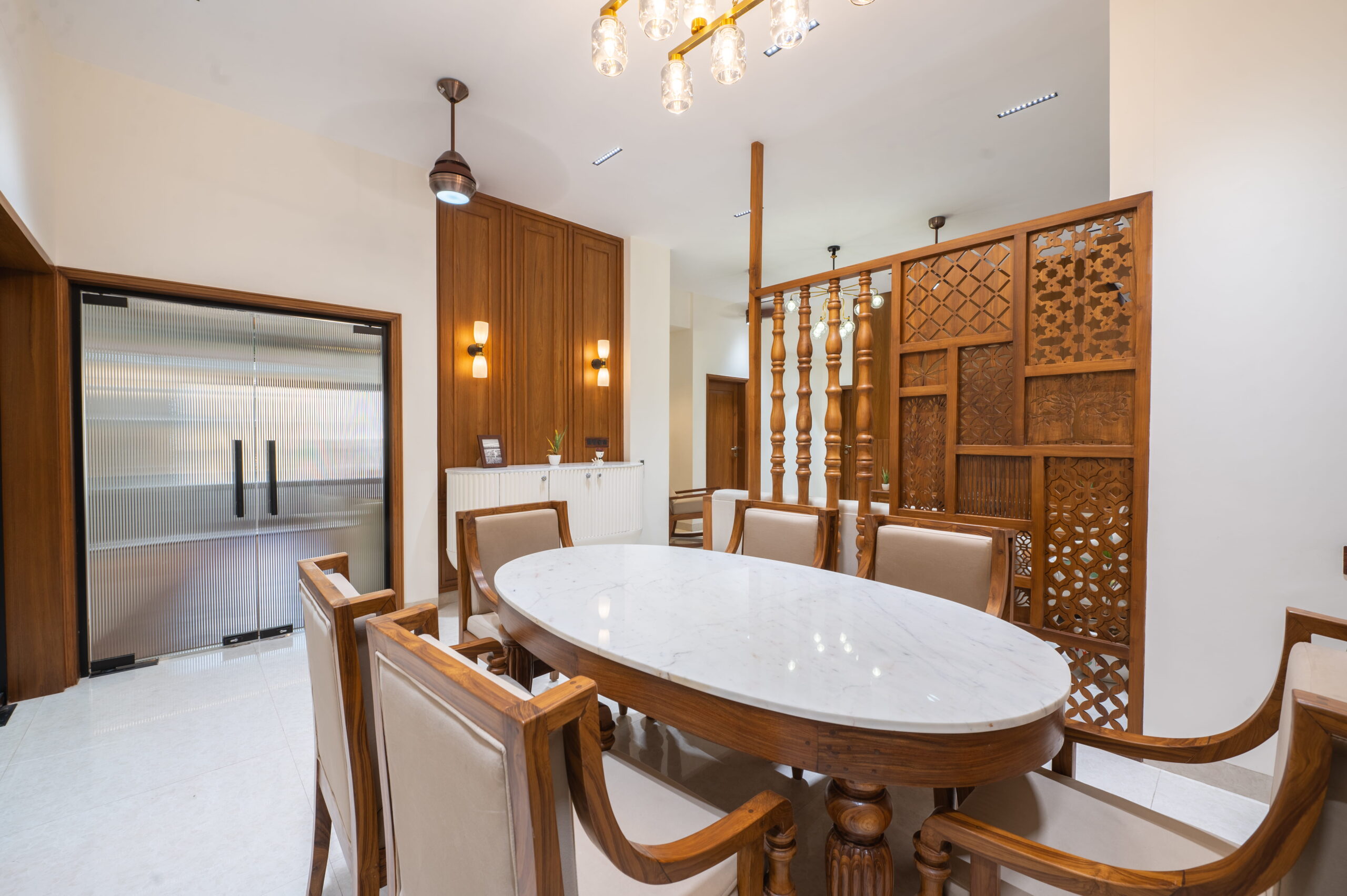 oval-marble-dining-table-wooden-partition.jpg